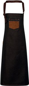 Premier PR136 - Division - Waxed look denim bib apron with faux leather Zwart / Tan Denim